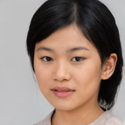 Joyful asian young-adult female with medium  black hair and brown eyes