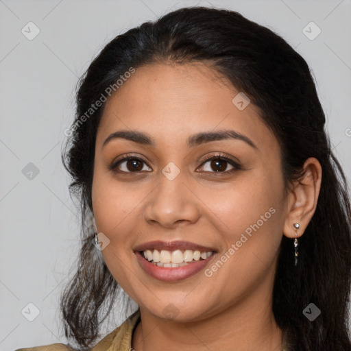 Joyful latino young-adult female with long  brown hair and brown eyes