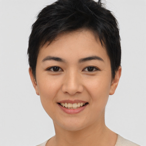 Joyful asian young-adult female with short  black hair and brown eyes