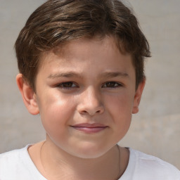 Joyful white child male with short  brown hair and brown eyes