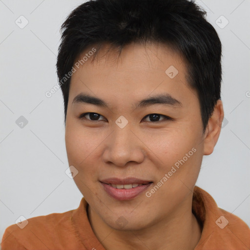 Joyful asian young-adult male with short  brown hair and brown eyes