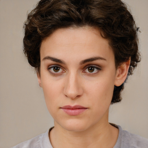 Neutral white young-adult female with short  brown hair and brown eyes