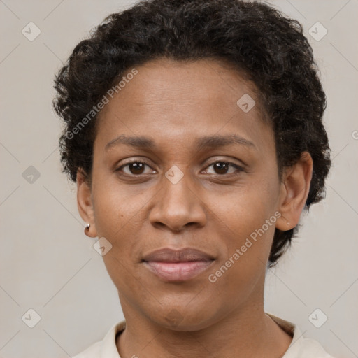 Joyful black adult female with short  brown hair and brown eyes