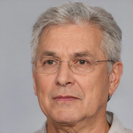 Neutral white middle-aged male with short  gray hair and brown eyes