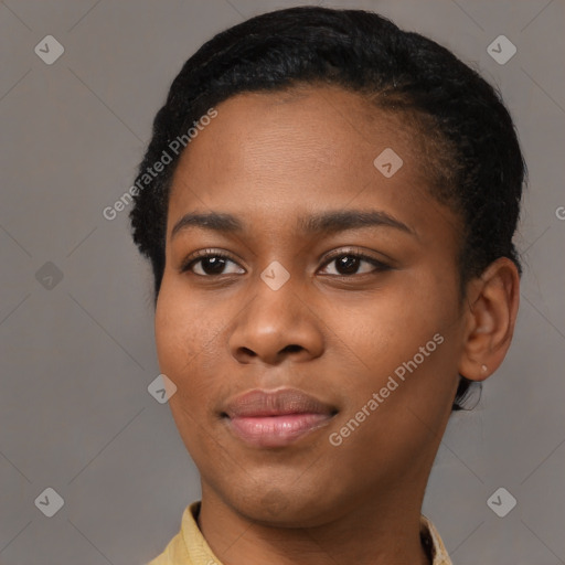 Joyful black young-adult female with short  black hair and brown eyes