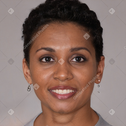 Joyful black young-adult female with short  brown hair and brown eyes