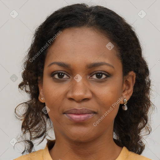 Joyful black young-adult female with long  brown hair and brown eyes