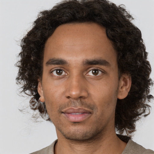 Neutral black young-adult male with short  brown hair and brown eyes