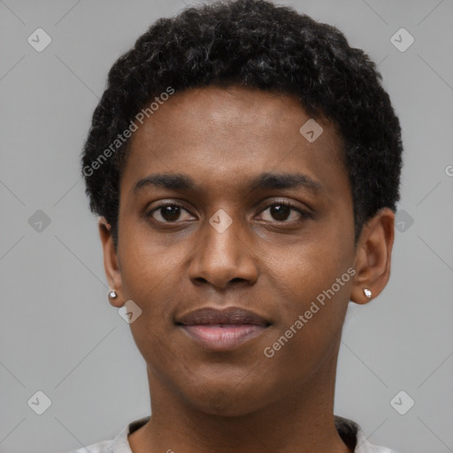 Joyful black young-adult male with short  black hair and brown eyes