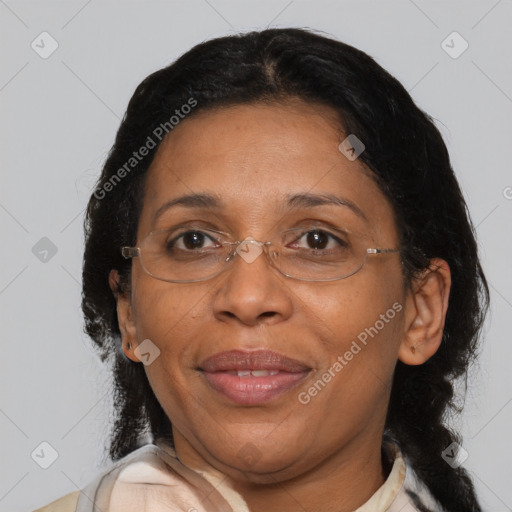 Joyful black adult female with medium  brown hair and brown eyes