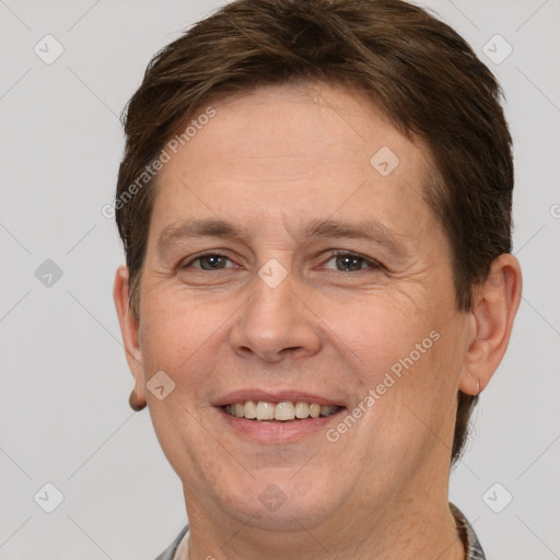 Joyful white adult female with short  brown hair and brown eyes