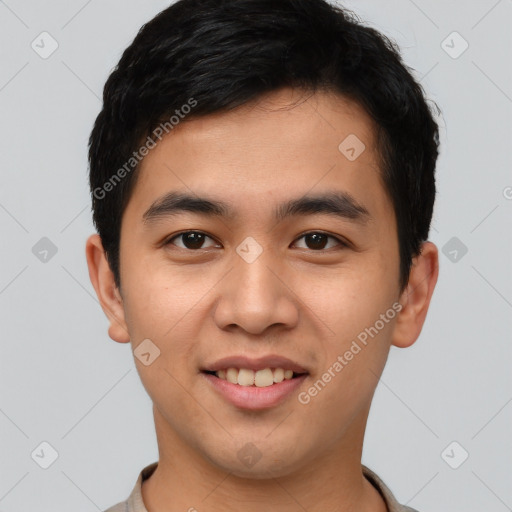 Joyful asian young-adult male with short  brown hair and brown eyes