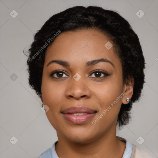 Joyful black young-adult female with medium  black hair and brown eyes