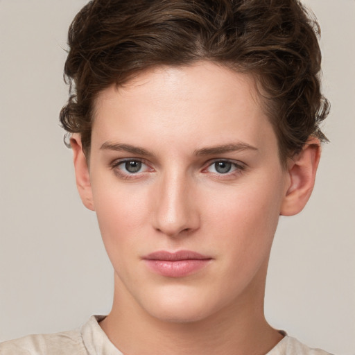 Neutral white young-adult female with short  brown hair and grey eyes