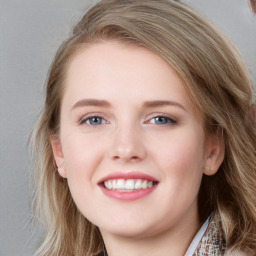 Joyful white young-adult female with medium  brown hair and blue eyes