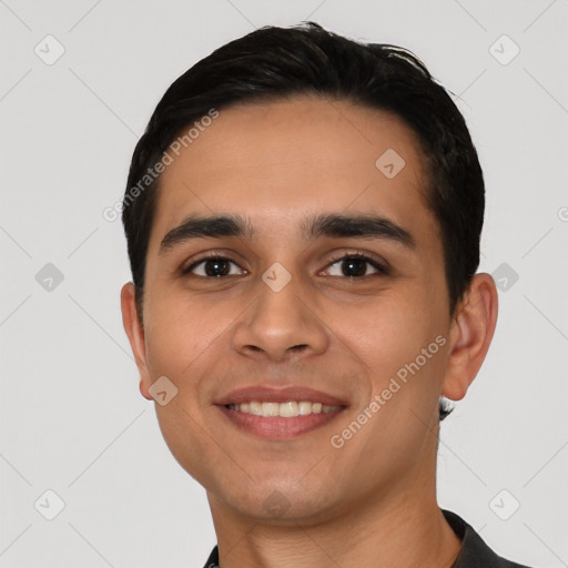 Joyful white young-adult male with short  black hair and brown eyes