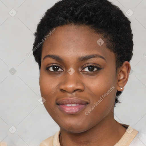 Joyful black young-adult female with short  black hair and brown eyes