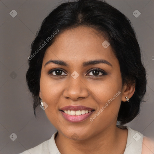 Joyful black young-adult female with medium  brown hair and brown eyes