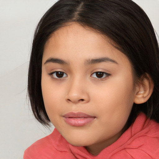 Joyful white child female with long  brown hair and brown eyes