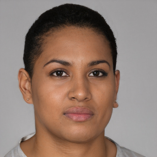 Joyful latino young-adult female with short  brown hair and brown eyes