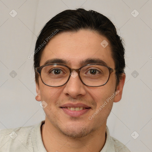 Joyful white adult male with short  brown hair and brown eyes