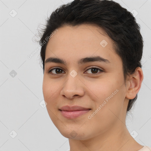 Joyful latino young-adult female with short  black hair and brown eyes