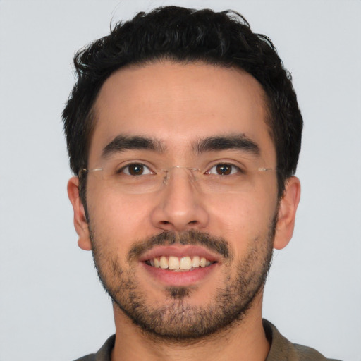 Joyful latino young-adult male with short  black hair and brown eyes