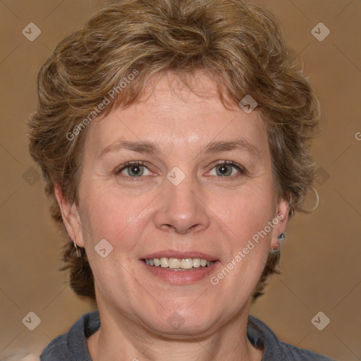 Joyful white adult female with medium  brown hair and blue eyes