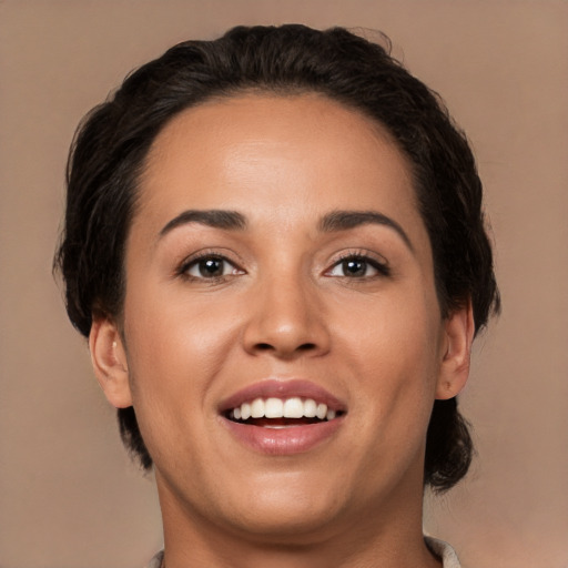 Joyful white young-adult female with medium  black hair and brown eyes