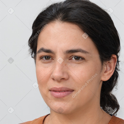 Joyful white adult female with medium  brown hair and brown eyes