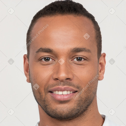 Joyful white young-adult male with short  brown hair and brown eyes