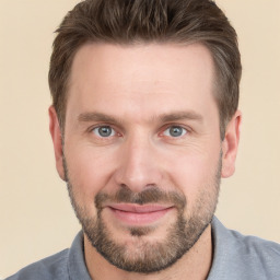 Joyful white adult male with short  brown hair and grey eyes