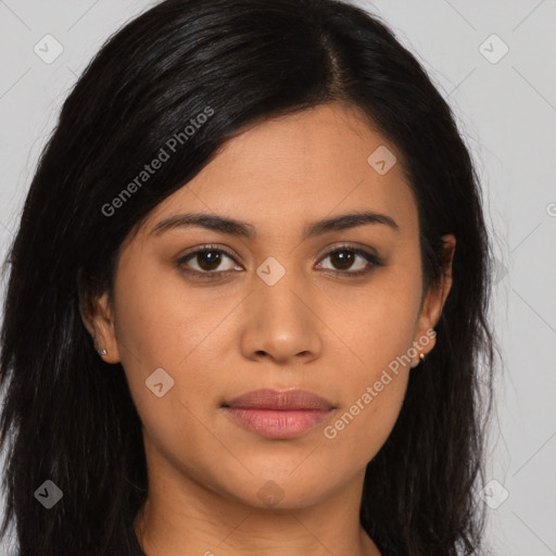 Joyful latino young-adult female with long  brown hair and brown eyes