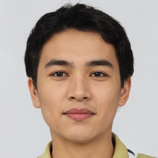 Joyful asian young-adult male with short  black hair and brown eyes