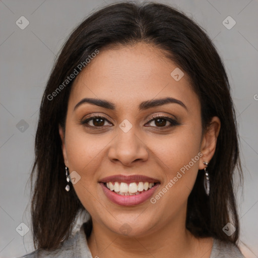 Joyful latino young-adult female with long  brown hair and brown eyes