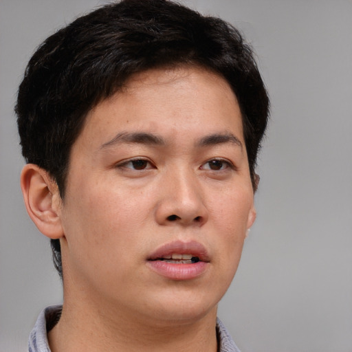 Neutral asian young-adult male with short  brown hair and brown eyes