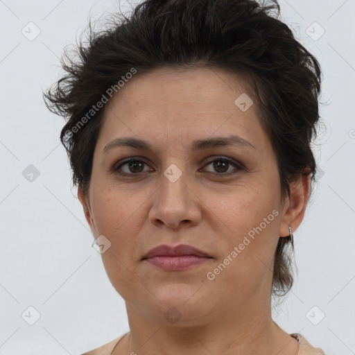 Joyful white adult female with short  brown hair and brown eyes