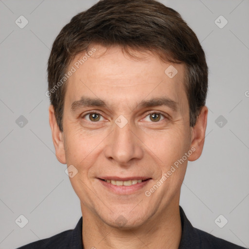 Joyful white adult male with short  brown hair and brown eyes