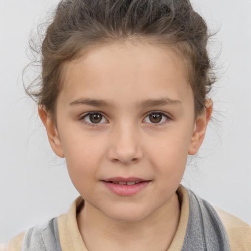 Joyful white child female with short  brown hair and brown eyes