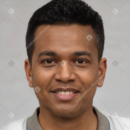 Joyful latino young-adult male with short  black hair and brown eyes