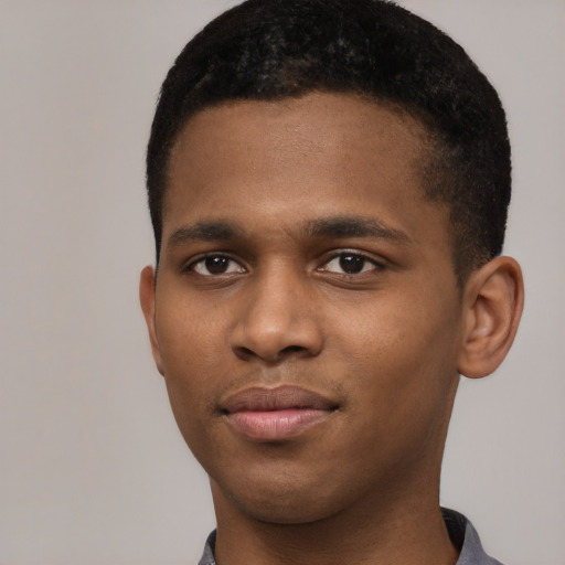 Joyful latino young-adult male with short  brown hair and brown eyes
