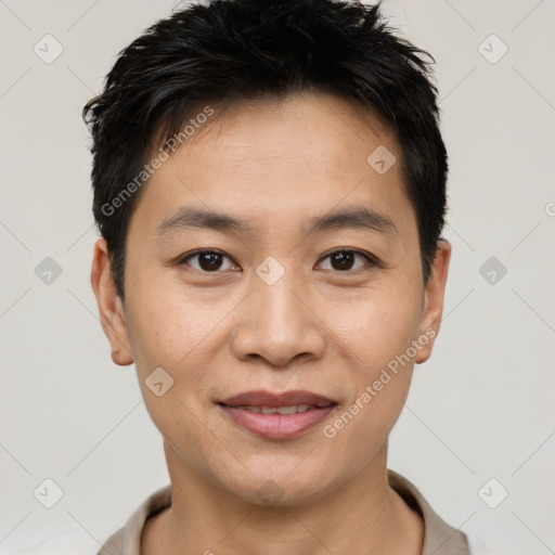 Joyful white young-adult male with short  black hair and brown eyes