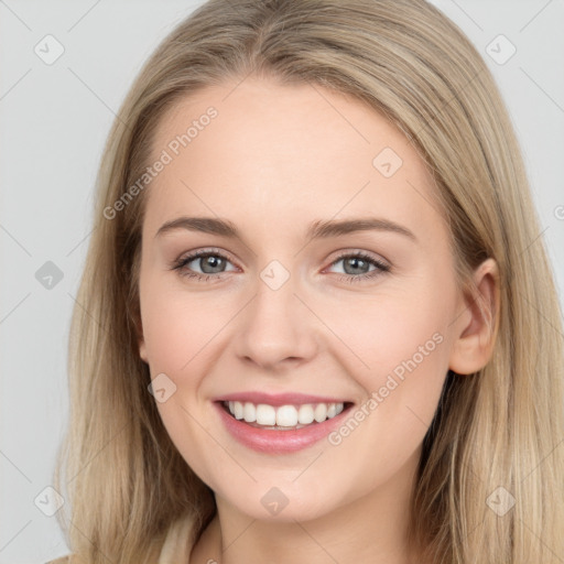 Joyful white young-adult female with long  brown hair and grey eyes