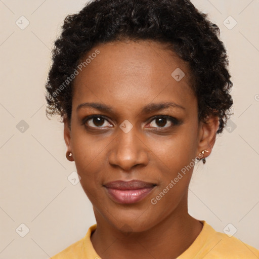 Joyful black young-adult female with short  black hair and brown eyes