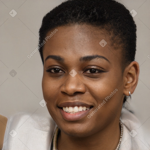 Joyful black young-adult female with short  black hair and brown eyes