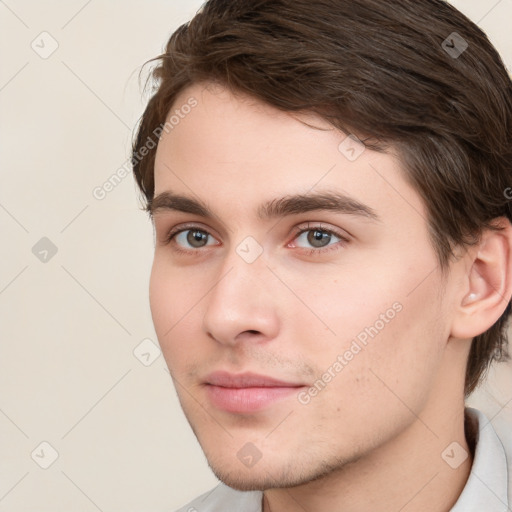 Neutral white young-adult male with short  brown hair and grey eyes