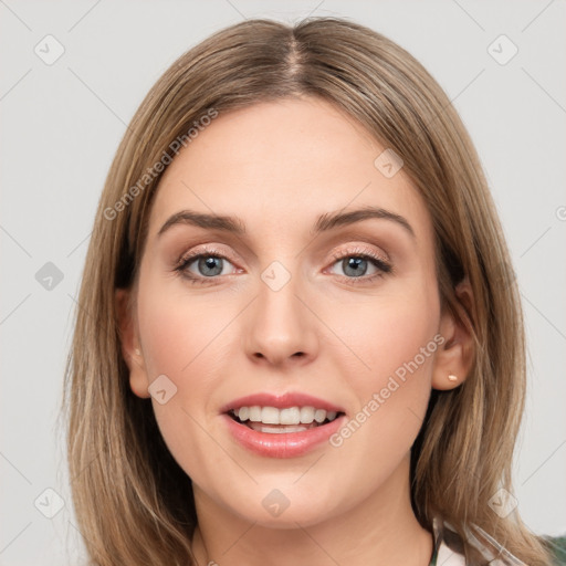 Joyful white young-adult female with long  brown hair and grey eyes