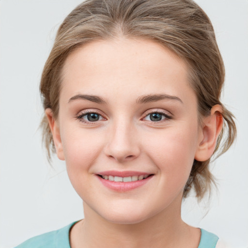 Joyful white young-adult female with medium  brown hair and blue eyes