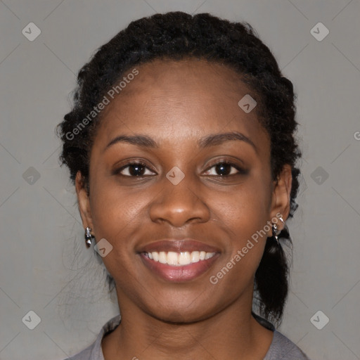 Joyful black young-adult female with medium  black hair and brown eyes