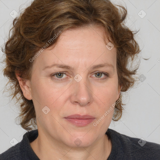 Joyful white adult female with medium  brown hair and blue eyes